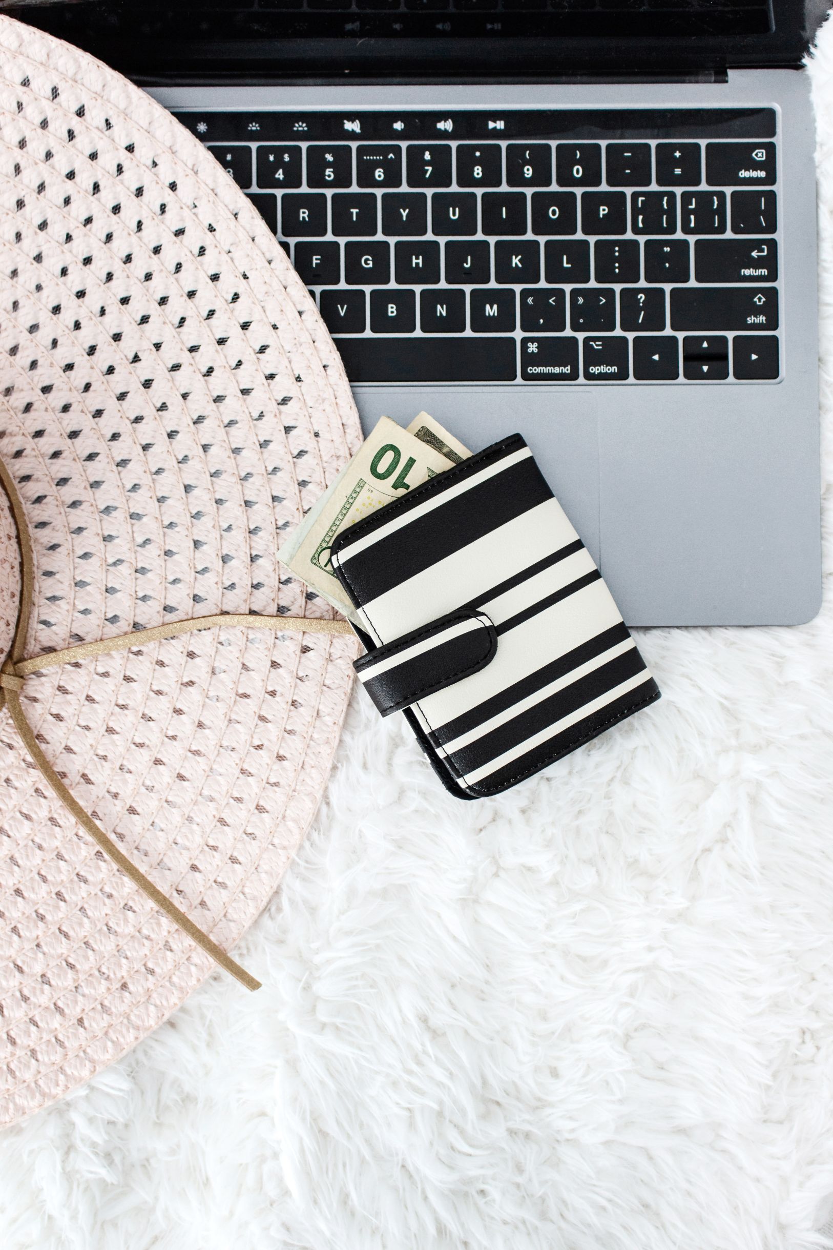 send client emails for projects money in wallet with laptop and floppy hat