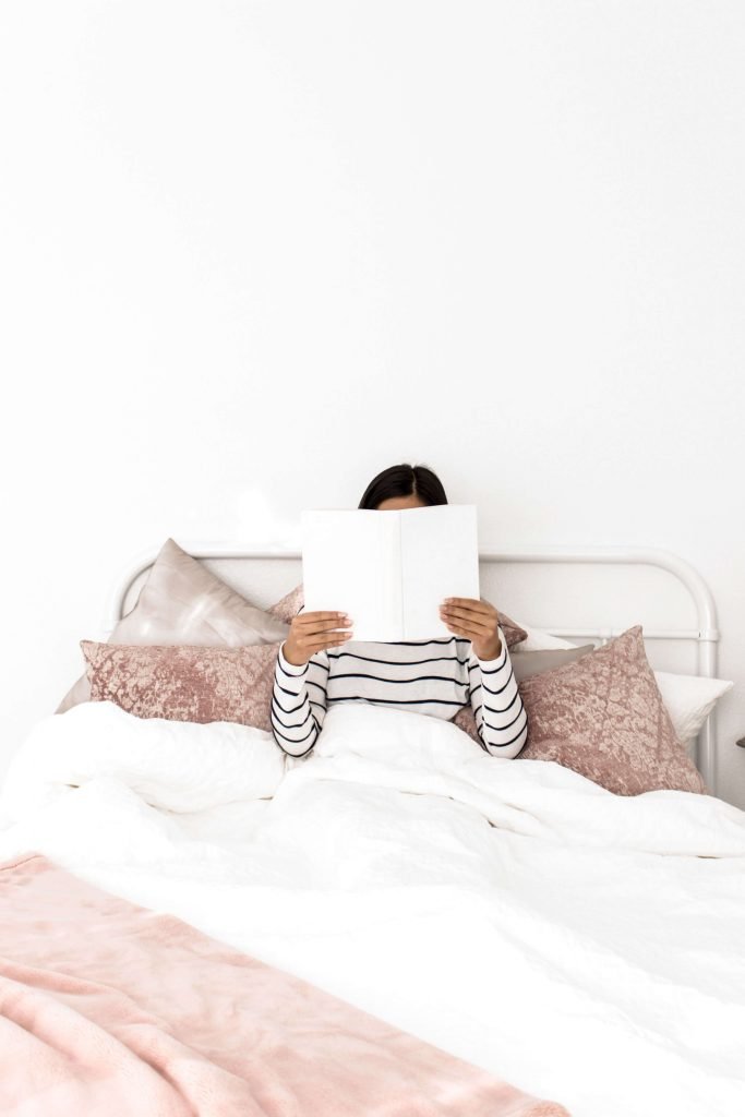 Relaxing in bed and reading