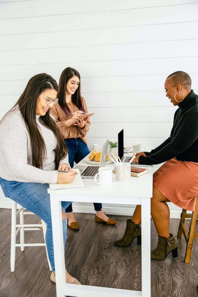 group of virtual assistants working together in home office