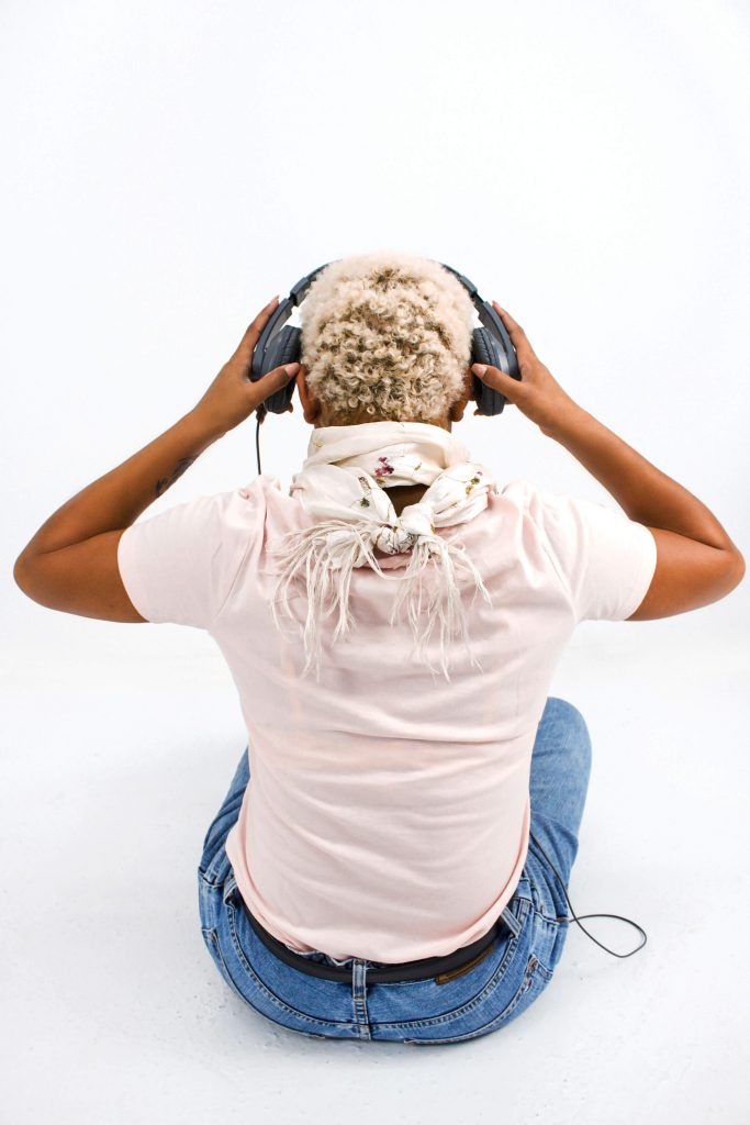 Woman sitting with headphones