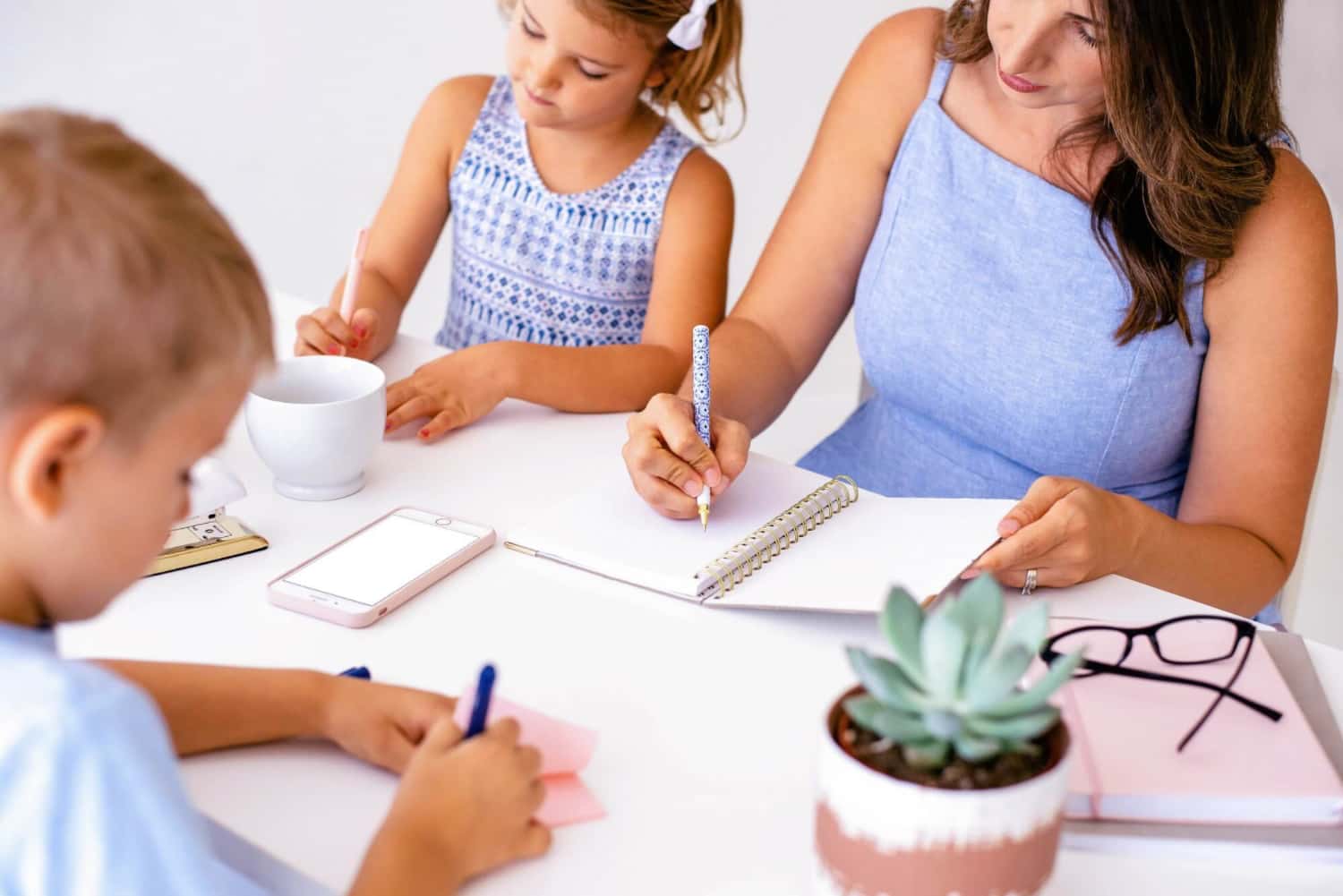 mom working with kids from home office