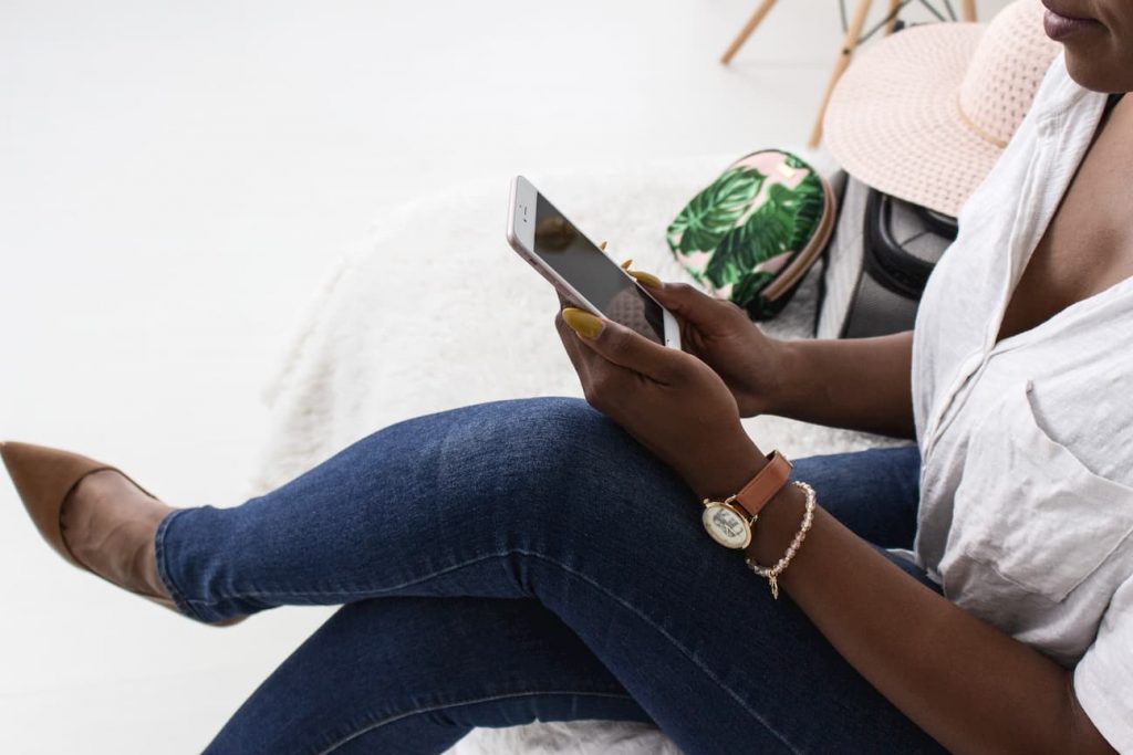 black woman on cell phone wearing heels