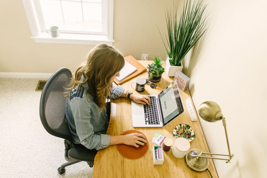 Chynna Benton at office desk and laptop