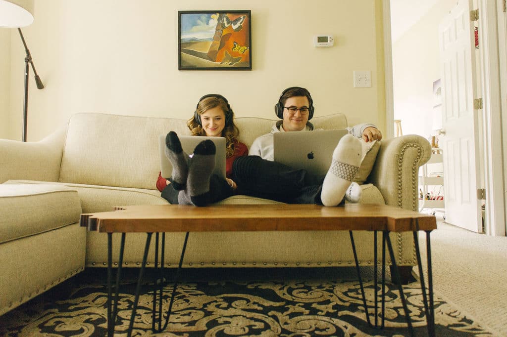 couple working on couch