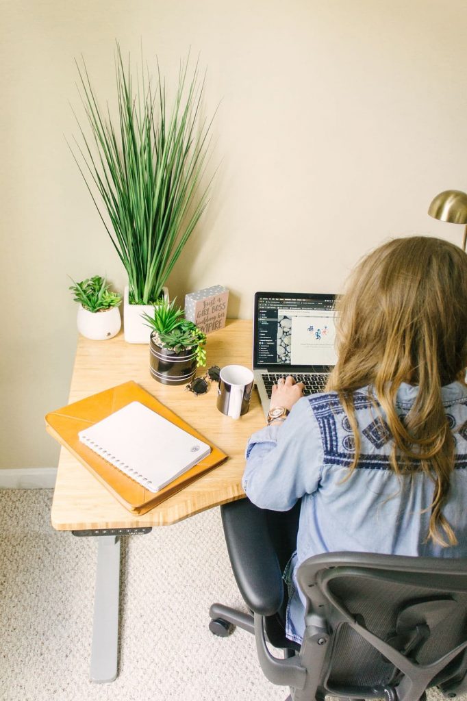woman sitting at desk working