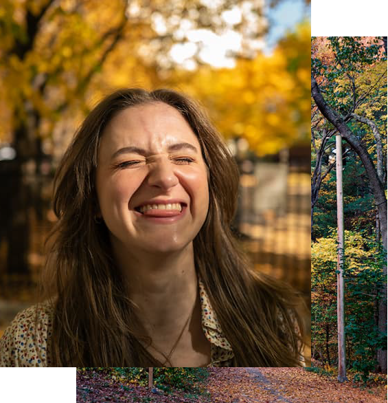 Chynna with eyes closed and goofy smile with forest path background